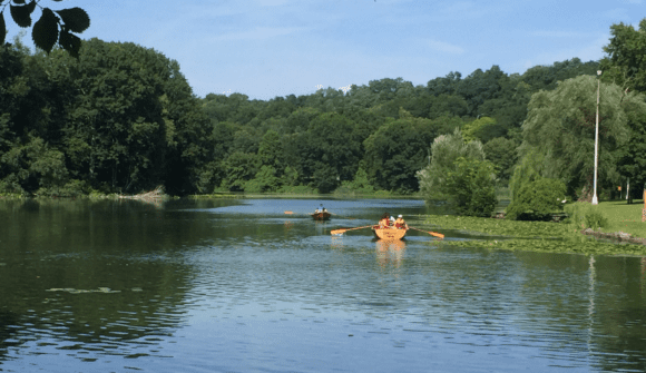 A group of people in canoes on a body of water.