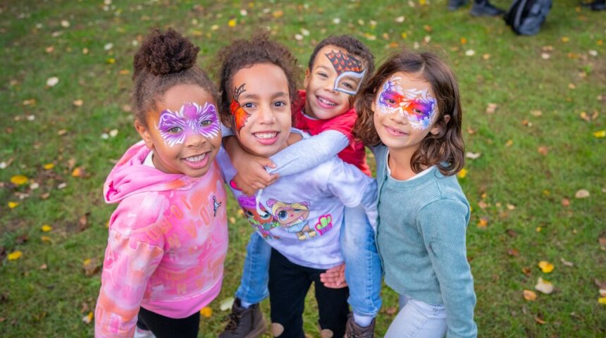 A group of girls with face paint.