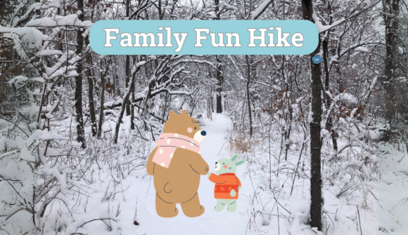 A snow covered trail with two cartoon bears walking on it and the words Family Fun Hike